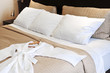 Hotel bed with bathrobe Hotel bed with bathrobe