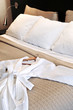 Hotel bed with bathrobe Hotel bed with bathrobe
