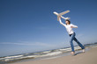 Teenager with plane on the beach Teenager with plane on the beach