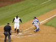Baseball player scoring a run