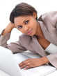 Business woman lying down by laptop