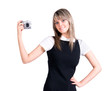 Young woman holding digital camera