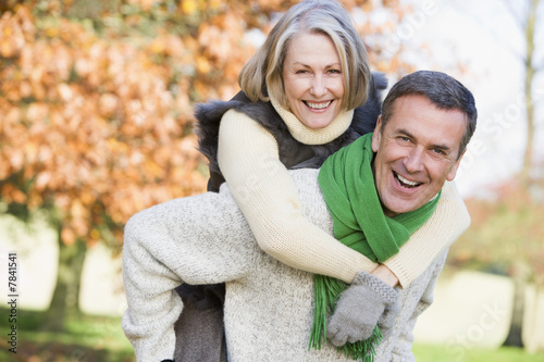Senior Man Giving Woman Piggyback Ride