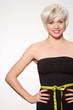 Young woman wearing tape measure