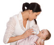 Foto: Mother feeding baby daughter Mother feeding baby daughter
