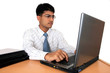 Young Indian business man working at his desk (Series)