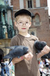 Boy is feeding the birds