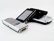 Several Mobile Phones and a PDA Leaning on Each Other