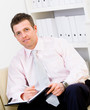Businessman sitting at office Businessman sitting at office