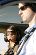 Foto: junge Frau mit Pilot im Helikopter junge Frau mit Pilot im Helikopter