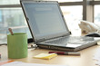 workspace - laptop,pen, cup on the desk