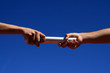 hands passing the batton hands passing the batton