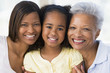 Grandmother with adult daughter and grandchild