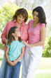 Grandmother with adult daughter and grandchild