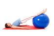 Young woman performing fitness exercises with a fitness ball. Young woman performing fitness exercises with a fitness ball.