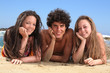 three happy teenagers on the beach three happy teenagers on the beach