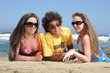 three happy teenagers on the beach three happy teenagers on the beach