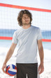A man playing beach volleyball