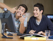 Two teenage boys studying using a computer