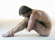 A male nude, sitting