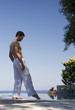 A man standing by a pool