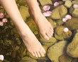 Close-up of feet in a natural pool