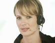 A young woman wearing an audio headset