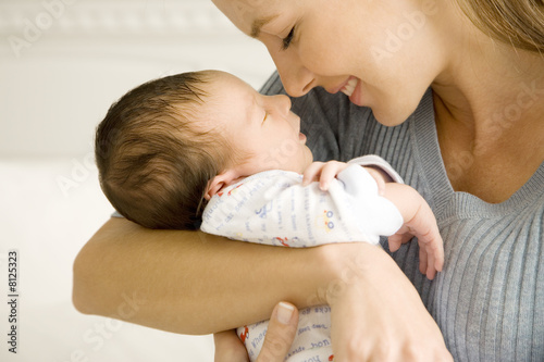 Photo: Mother holding her young baby Mother holding her young baby