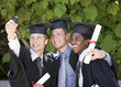 Foto: Three graduates celebrating Three graduates celebrating