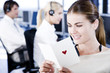 Businesswoman reading her valentines card in an office