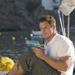A man writing a postcard
