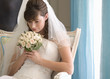 A bride sitting on a chair