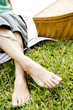 woman's bare feet crossed at the ankle