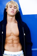 Portrait of a teenage man with toned abdominal muscles