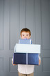 boy with ginger hair holding presents