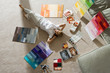 Photo: Senior man lying on floor at home, looking at colour charts, hands behind head, smiling, portrait, overhead view Senior man lying on floor at home, looking at colour charts, hands behind head, smiling, portrait, overhead view