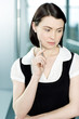 Portrait of young businesswoman or secretary holding a pen