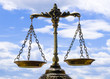 A photo of the scales of justice with a balance theme overlay