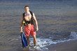 A male scuba diver returning to the shore