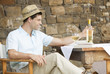 A man drinking a glass of wine