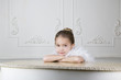 Portrait of a young girl with a feather boa in dressing up clothes