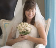 A bride sitting on a chair
