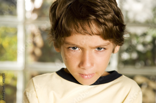 Photo: Latino boy frowning Latino boy frowning