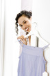 Woman trying on a sun top in the changing room of a shop