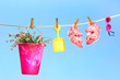 Summer toys and sandals on clothesline