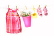 Little girl clothes and toys on a clothesline