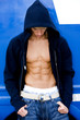 Portrait of a teenage man with toned abdominal muscles