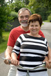 An attractive senior couple bicycling