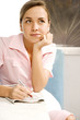 Diner waitress daydreaming whilst looking at the classified section of a newspaper