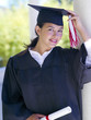 Graduate, hand on cap, portrait